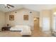 Spacious living room featuring vaulted ceilings and a plush sectional, creating a welcoming atmosphere at 2817 La Mancha Ct, Punta Gorda, FL 33950