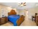 A spacious main bedroom with a large bed and a ceiling fan at 2817 La Mancha Ct, Punta Gorda, FL 33950