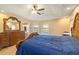 Main bedroom with tile floors, ceiling fan, and a large dresser at 2817 La Mancha Ct, Punta Gorda, FL 33950