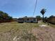 Large backyard with plenty of space, features partial fencing and a palm tree at 2919 Bayshore Gardens Pkwy, Bradenton, FL 34207