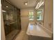 Updated bathroom with a marble vanity top and glass shower at 2919 Bayshore Gardens Pkwy, Bradenton, FL 34207