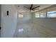 Well-lit bedroom with a ceiling fan and windows for natural light at 2919 Bayshore Gardens Pkwy, Bradenton, FL 34207