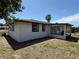 Exterior angle showcasing the home's patio, landscaping and side yard at 2919 Bayshore Gardens Pkwy, Bradenton, FL 34207