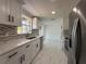 Bright kitchen features stainless steel appliances, white cabinets, and marble countertops at 2919 Bayshore Gardens Pkwy, Bradenton, FL 34207