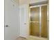 This bathroom features a standing shower with glass sliding doors next to a white door at 320 25Th W St, Bradenton, FL 34205