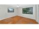 This empty bedroom has hardwood floors and two large windows at 320 25Th W St, Bradenton, FL 34205