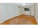 This empty bedroom has wood floors and a ceiling fan next to a folding door closet at 320 25Th W St, Bradenton, FL 34205