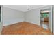 Bright dining room with parquet flooring and neutral walls, leading into a cozy kitchen area at 320 25Th W St, Bradenton, FL 34205