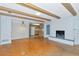 Open living space with hardwood floors, brick fireplace, and kitchen access at 320 25Th W St, Bradenton, FL 34205