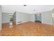 Open floor plan with hardwood floors connecting the living and dining areas at 320 25Th W St, Bradenton, FL 34205