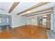 Spacious living area with hardwood flooring and exposed beam ceiling at 320 25Th W St, Bradenton, FL 34205