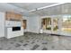 Large sunroom with tiled flooring and an outdoor cooking area with an outdoor grill at 320 25Th W St, Bradenton, FL 34205