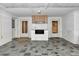 Open sunroom with tiled flooring and an outdoor cooking area with an outdoor grill at 320 25Th W St, Bradenton, FL 34205