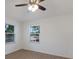 Serene bedroom with wood-look floors and lots of natural light from the large windows at 3356 Maiden Ln, Sarasota, FL 34231