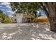 Two-story home featuring a wooden deck, light gray siding, garage, and rock landscaping at 3356 Maiden Ln, Sarasota, FL 34231