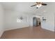 Open-concept living room leading to kitchen with stainless appliances and tile flooring at 3356 Maiden Ln, Sarasota, FL 34231