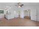 Open-concept living room featuring a kitchen area and doorways to multiple rooms at 3356 Maiden Ln, Sarasota, FL 34231