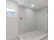 Modern glass shower with white subway tile, and updated fixtures at 3356 Maiden Ln, Sarasota, FL 34231