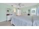 Bright bedroom featuring dressers, a mirror, and an ensuite bathroom at 337 Myrtle Ct, Palm Harbor, FL 34683