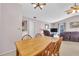 Comfortable dining area with view of living space; neutral color scheme with wood furniture at 337 Myrtle Ct, Palm Harbor, FL 34683
