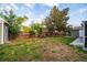 The fenced backyard has a shed, picnic table, and mature trees at 3515 W Pearl Ave, Tampa, FL 33611