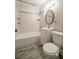 Updated bathroom with a new toilet, vanity, and shower-tub, highlighted by modern fixtures at 3515 W Pearl Ave, Tampa, FL 33611