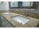 Bathroom vanity with granite countertop and double sinks at 3515 W Pearl Ave, Tampa, FL 33611