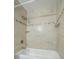 Bathroom bathtub with tiled shower and built-in niche at 3515 W Pearl Ave, Tampa, FL 33611