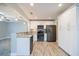 Modern kitchen with stainless steel appliances, granite countertops, and white cabinets at 3515 W Pearl Ave, Tampa, FL 33611