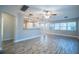 Spacious living room with wood-look tile floors and lots of natural light at 3515 W Pearl Ave, Tampa, FL 33611