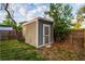 Backyard shed perfect for extra storage and organizing at 3515 W Pearl Ave, Tampa, FL 33611