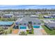 Wide aerial view of a charming duplex property with lush landscaping and bay views in neighborhood at 3711 118Th W St, Bradenton, FL 34210