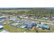 Wide aerial view of a charming home with lush landscaping and fenced pool in neighborhood at 3711 118Th W St, Bradenton, FL 34210
