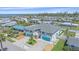 Wide aerial view of a charming duplex property with lush landscaping and neighborhood with bay views at 3711 118Th W St, Bradenton, FL 34210
