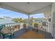 Relaxing covered balcony with seating, offering serene views of the surrounding neighborhood at 3711 118Th W St, Bradenton, FL 34210
