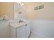 A well-lit bathroom featuring a modern white vanity, clean lines, and elegant fixtures offers a serene and functional space at 3711 118Th W St, Bradenton, FL 34210