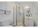 Clean and modern bathroom featuring a glass-enclosed shower, white cabinets, and contemporary fixtures at 3711 118Th W St, Bradenton, FL 34210