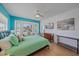 Comfortable bedroom with a bay window, ceiling fan, ample natural light, and stylish decor at 3711 118Th W St, Bradenton, FL 34210