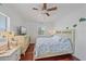 Comfortable bedroom featuring a ceiling fan, wood floors, and a nautical themed decor at 3711 118Th W St, Bradenton, FL 34210