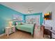 Bright and airy bedroom featuring a bay window, stylish decor, and a ceiling fan at 3711 118Th W St, Bradenton, FL 34210
