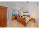 Cozy bedroom featuring wood furniture, light wood flooring, and a decorative nautical theme at 3711 118Th W St, Bradenton, FL 34210