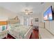 Bright bedroom with sea-themed decor, hardwood floors, ceiling fan, and a TV at 3711 118Th W St, Bradenton, FL 34210