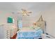 Fresh bedroom with a ceiling fan, TV, and a charming coastal-themed design at 3711 118Th W St, Bradenton, FL 34210