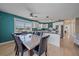 Cozy dining room with a table set for six next to a spacious, modern kitchen at 3711 118Th W St, Bradenton, FL 34210