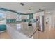 Bright kitchen boasts stainless steel appliances, a large island, and ample counter space at 3711 118Th W St, Bradenton, FL 34210