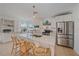 Bright kitchen features white cabinetry, countertops, and stainless steel appliances at 3711 118Th W St, Bradenton, FL 34210