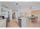 Open kitchen with an island that features stainless steel appliances and hardwood floors at 3711 118Th W St, Bradenton, FL 34210