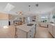 Bright open kitchen with island, stainless steel appliances, and a view into the living area at 3711 118Th W St, Bradenton, FL 34210