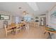 Open-concept kitchen and dining area with modern appliances and spacious island at 3711 118Th W St, Bradenton, FL 34210