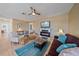 Comfortable living room featuring a fireplace, plush seating, and a ceiling fan at 3711 118Th W St, Bradenton, FL 34210